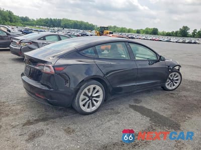 Trzecie zdjęcie samochodu z tyłu: 2022 TESLA MODEL 3 VIN:5YJ3E1EA4NF289558 - miniatura