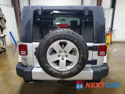 Zdjęcie 6 z 13 samochodu: 2010 JEEP WRANGLER SAHARA VIN:1J4AA5D15AL214901 - miniatura