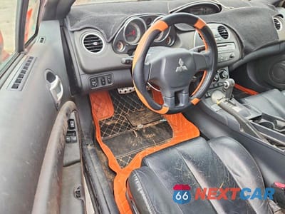 Zdjęcie 8 z 12 samochodu: 2012 MITSUBISHI ECLIPSE SPYDER GS VIN:4A37L5EFXCE005842 - miniatura