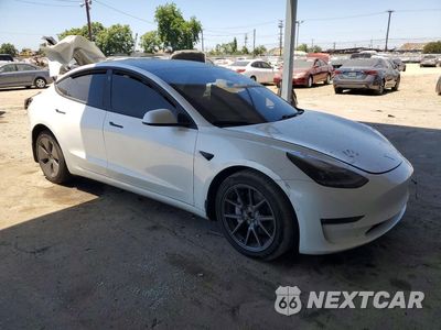 Czwarte zdjęcie samochodu z boku: 2021 TESLA MODEL 3 VIN:5YJ3E1EBXMF941753 - miniatura