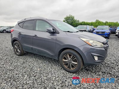 Czwarte zdjęcie samochodu z boku: 2015 HYUNDAI TUCSON SE VIN:KM8JUCAG7FU955283 - miniatura