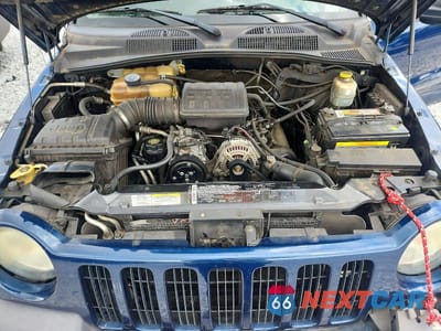 Zdjęcie 11 z 12 samochodu: 2003 JEEP LIBERTY SPORT VIN:1J4GK48K93W619911 - miniatura
