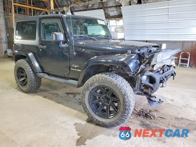 Czwarte zdjęcie samochodu z boku: 2018 JEEP WRANGLER SAHARA VIN:1C4AJWBG7JL859732 - miniatura