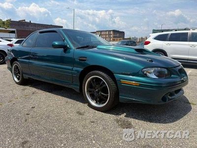 Czwarte zdjęcie samochodu z boku: 1996 PONTIAC GRAND AM GT VIN:1G2NW12M1TC832982 - miniatura