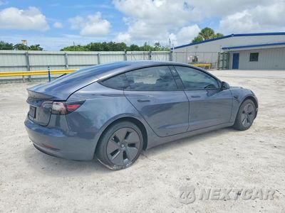 Trzecie zdjęcie samochodu z tyłu: 2023 TESLA MODEL 3 VIN:5YJ3E1EA6PF468395 - miniatura