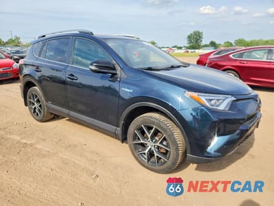 Czwarte zdjęcie samochodu z boku: 2018 TOYOTA RAV4 HV SE VIN:JTMJJREV0JD191035 - miniatura