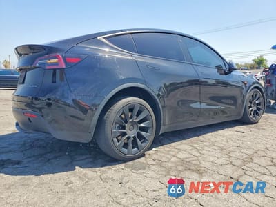 Trzecie zdjęcie samochodu z tyłu: 2022 TESLA MODEL Y VIN:7SAYGAEE6NF489086 - miniatura