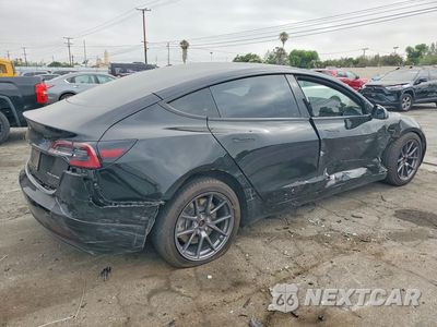 Trzecie zdjęcie samochodu z tyłu: 2021 TESLA MODEL 3 VIN:5YJ3E1EB6MF003815 - miniatura
