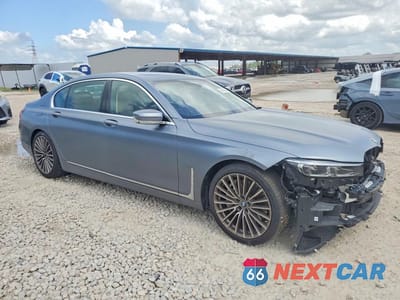 Czwarte zdjęcie samochodu z boku: 2022 BMW 750 XI VIN:WBA7U2C00NCK71802 - miniatura