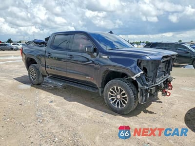 Czwarte zdjęcie samochodu z boku: 2022 GMC SIERRA K1500 AT4 VIN:1GTUUEET1NZ618999 - miniatura