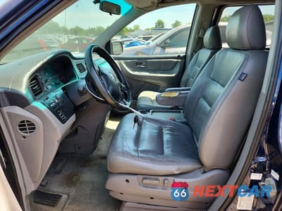 Zdjęcie 7 z 13 samochodu: 2004 HONDA ODYSSEY EXL VIN:2HKRL18984H500004 - miniatura