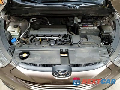 Zdjęcie 12 z 14 samochodu: 2011 HYUNDAI TUCSON GLS VIN:KM8JUCAC8BU136449 - miniatura