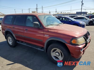 Czwarte zdjęcie samochodu z boku: 2000 MITSUBISHI MONTERO SPORT LS VIN:JA4LS31H9YP055508 - miniatura
