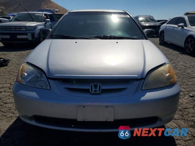 Piąte zdjęcie samochodu w środku: 2001 HONDA CIVIC LX VIN:1HGEM22551L007252 - miniatura