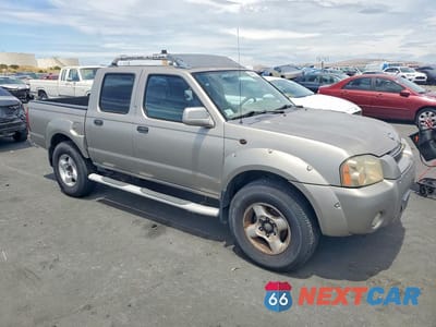 Czwarte zdjęcie samochodu z boku: 2001 NISSAN FRONTIER XE VIN:1N6ED27T11C322004 - miniatura