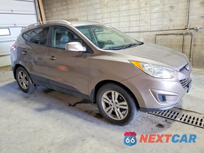 Czwarte zdjęcie samochodu z boku: 2011 HYUNDAI TUCSON GLS VIN:KM8JUCAC8BU136449 - miniatura