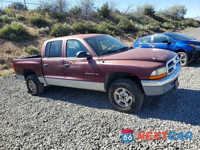 Czwarte zdjęcie samochodu z boku: 2001 DODGE DAKOTA QUAD VIN:1B7HG2AZ21S181924 - miniatura