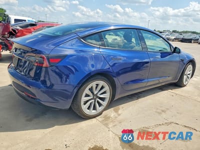 Trzecie zdjęcie samochodu z tyłu: 2022 TESLA MODEL 3 VIN:5YJ3E1EA8NF290714 - miniatura