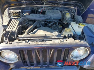 Zdjęcie 11 z 12 samochodu: 1999 JEEP WRANGLER VIN:1J4FY29P2XP472503 - miniatura