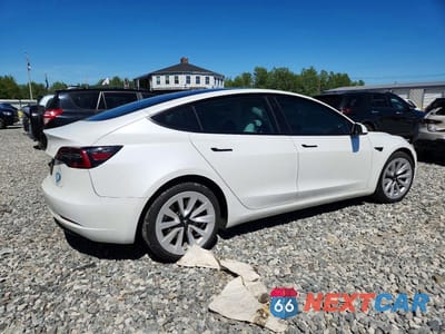 Trzecie zdjęcie samochodu z tyłu: 2023 TESLA MODEL 3 VIN:5YJ3E1EA8PF655654 - miniatura
