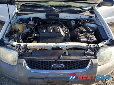 Zdjęcie 12 z 13 samochodu: 2003 FORD ESCAPE XLT VIN:1FMYU93103KE07031 - miniatura