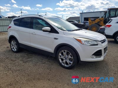 Czwarte zdjęcie samochodu z boku: 2014 FORD ESCAPE TITANIUM VIN:1FMCU0J95EUA99571 - miniatura