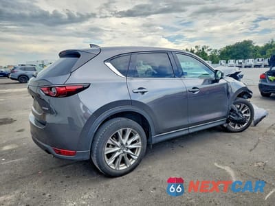 Trzecie zdjęcie samochodu z tyłu: 2021 MAZDA CX-5 GRAND TOURING VIN:JM3KFBDM3M1499528 - miniatura