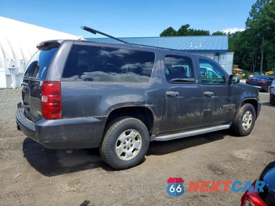 Trzecie zdjęcie samochodu z tyłu: 2010 CHEVROLET SUBURBAN K1500 LS VIN:1GNUKHE36AR271985 - miniatura
