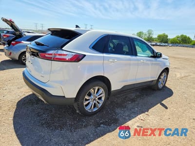Trzecie zdjęcie samochodu z tyłu: 2022 FORD EDGE TITANIUM VIN:2FMPK4K92NBA57183 - miniatura