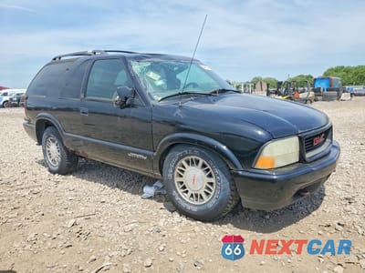 Czwarte zdjęcie samochodu z boku: 2001 GMC JIMMY VIN:1GKCT18W31K254864 - miniatura
