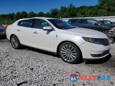 Czwarte zdjęcie samochodu z boku: 2016 LINCOLN MKS VIN:1LNHL9DKXGG602041 - miniatura