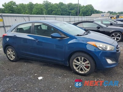 Czwarte zdjęcie samochodu z boku: 2014 HYUNDAI ELANTRA GT BASE VIN:KMHD35LH1EU172010 - miniatura