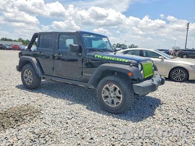 Czwarte zdjęcie samochodu z boku: 2016 JEEP WRANGLER UNLIMITED RUBICON VIN:1C4BJWFG8GL102961 - miniatura
