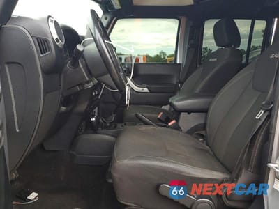 Zdjęcie 7 z 13 samochodu: 2016 JEEP WRANGLER UNLIMITED SAHARA VIN:1C4BJWEG0GL253326 - miniatura