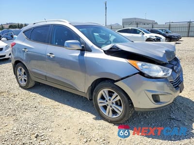 Czwarte zdjęcie samochodu z boku: 2011 HYUNDAI TUCSON GLS VIN:KM8JU3AC1BU239454 - miniatura