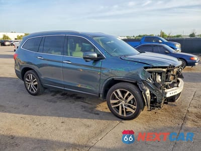 Czwarte zdjęcie samochodu z boku: 2017 HONDA PILOT TOURING VIN:5FNYF5H96HB019120 - miniatura