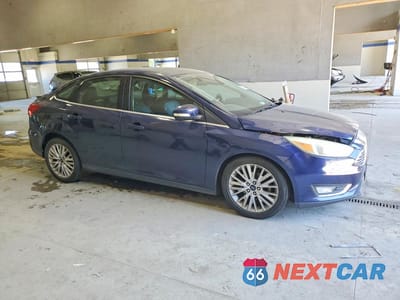 Czwarte zdjęcie samochodu z boku: 2016 FORD FOCUS TITANIUM VIN:1FADP3J26GL335759 - miniatura