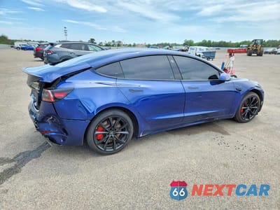 Trzecie zdjęcie samochodu z tyłu: 2021 TESLA MODEL 3 VIN:5YJ3E1EC9MF870487 - miniatura