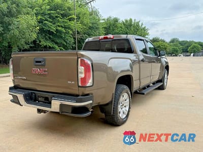 Czwarte zdjęcie samochodu z boku: 2016 GMC CANYON SLE VIN:1GTG5CE39G1115172 - miniatura