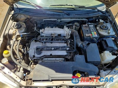 Zdjęcie 11 z 12 samochodu: 1999 MAZDA PROTEGE DX VIN:JM1BJ2220X0179909 - miniatura