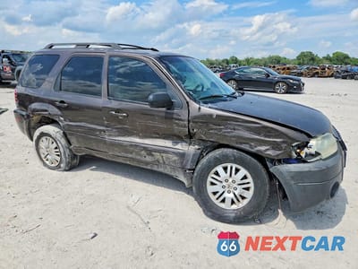 Czwarte zdjęcie samochodu z boku: 2006 MERCURY MARINER VIN:4M2YU57106KJ18835 - miniatura