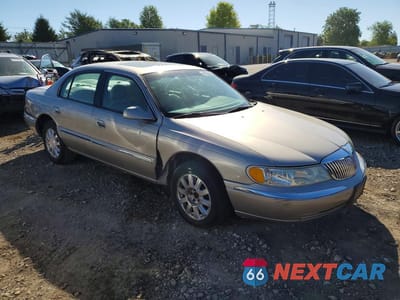 Czwarte zdjęcie samochodu z boku: 2002 LINCOLN CONTINENTAL VIN:1LNHM97V62Y699843 - miniatura