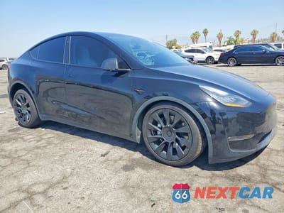 Czwarte zdjęcie samochodu z boku: 2022 TESLA MODEL Y VIN:7SAYGAEE6NF489086 - miniatura
