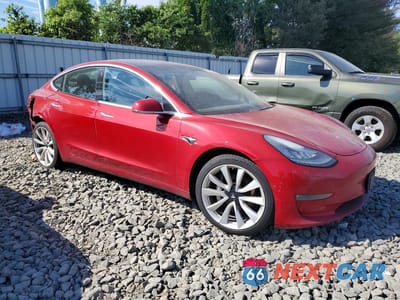 Czwarte zdjęcie samochodu z boku: 2018 TESLA MODEL 3 VIN:5YJ3E1EB7JF117222 - miniatura