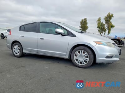 Czwarte zdjęcie samochodu z boku: 2010 HONDA INSIGHT LX VIN:JHMZE2H55AS042012 - miniatura