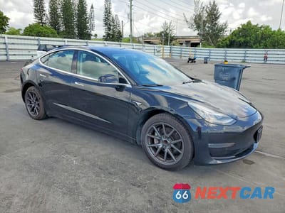 Czwarte zdjęcie samochodu z boku: 2019 TESLA MODEL 3 VIN:5YJ3E1EAXKF416096 - miniatura