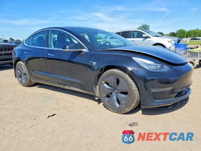 Czwarte zdjęcie samochodu z boku: 2020 TESLA MODEL 3 VIN:5YJ3E1EB0LF599485 - miniatura