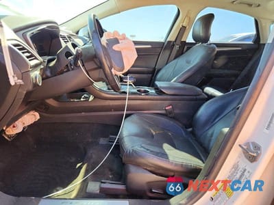 Zdjęcie 7 z 13 samochodu: 2014 FORD FUSION TITANIUM PHEV VIN:3FA6P0SU6ER150696 - miniatura