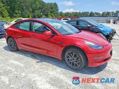 Czwarte zdjęcie samochodu z boku: 2023 TESLA MODEL 3 VIN:5YJ3E1EA3PF453899 - miniatura