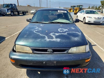 Piąte zdjęcie samochodu w środku: 1997 TOYOTA COROLLA BASE VIN:1NXBA02E8VZ621027 - miniatura